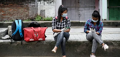 Representative Image Passengers wait at a bus stop in Guwahati