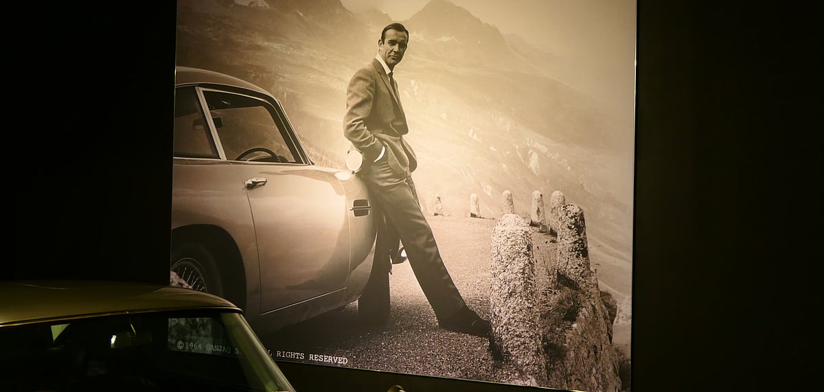 A picture of Sean Connery with the famous Aston Martin at the Louwman Museum