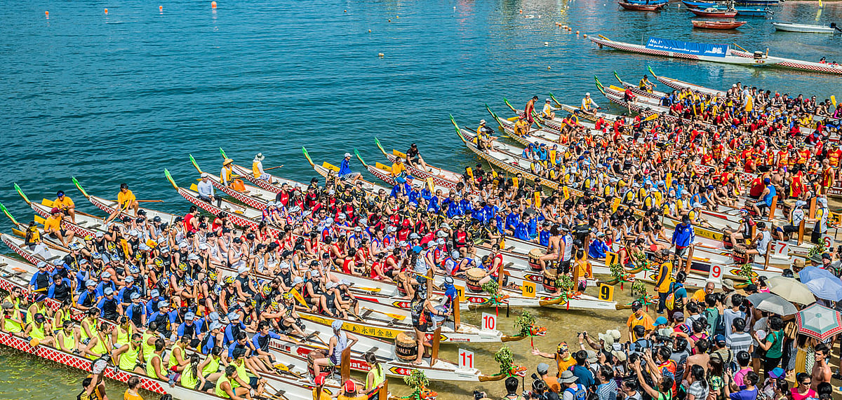 People racing the Dragon boats festival race in Stanley beach, Hong Kong