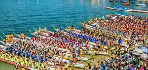 People racing the Dragon boats festival race in Stanley beach, Hong Kong