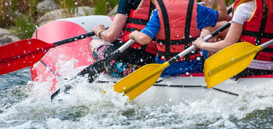 Close-up view of oars with splashing water