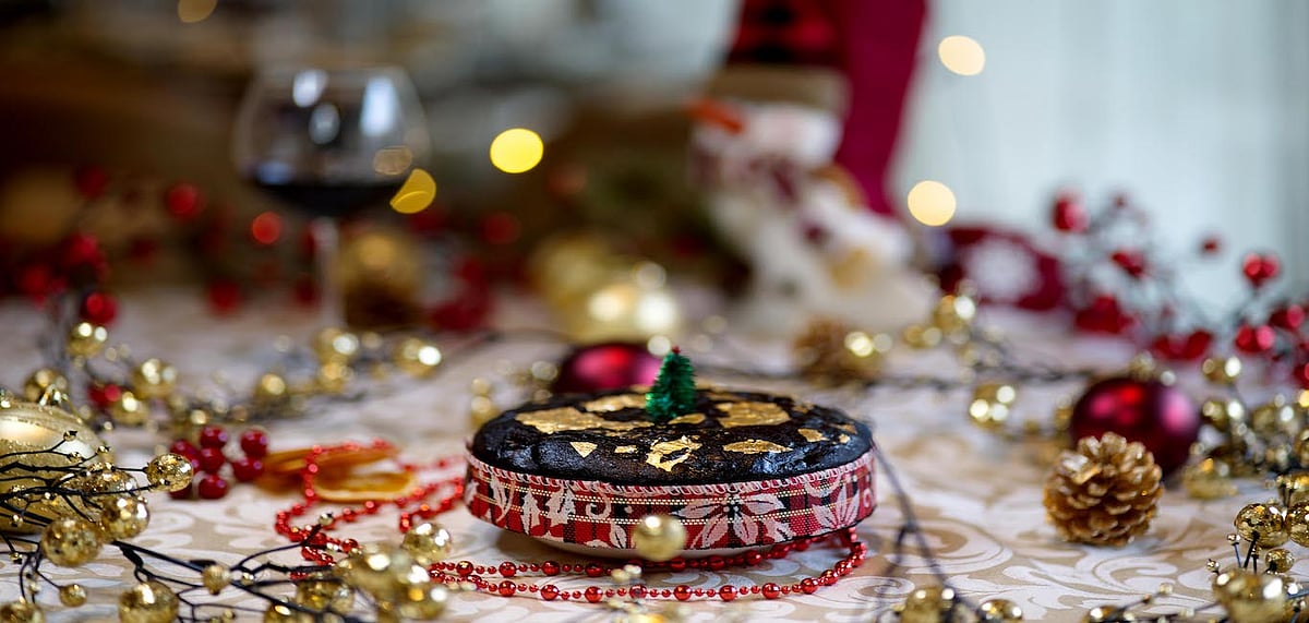 The plum cake has been topped with a 24 karat gold leaf