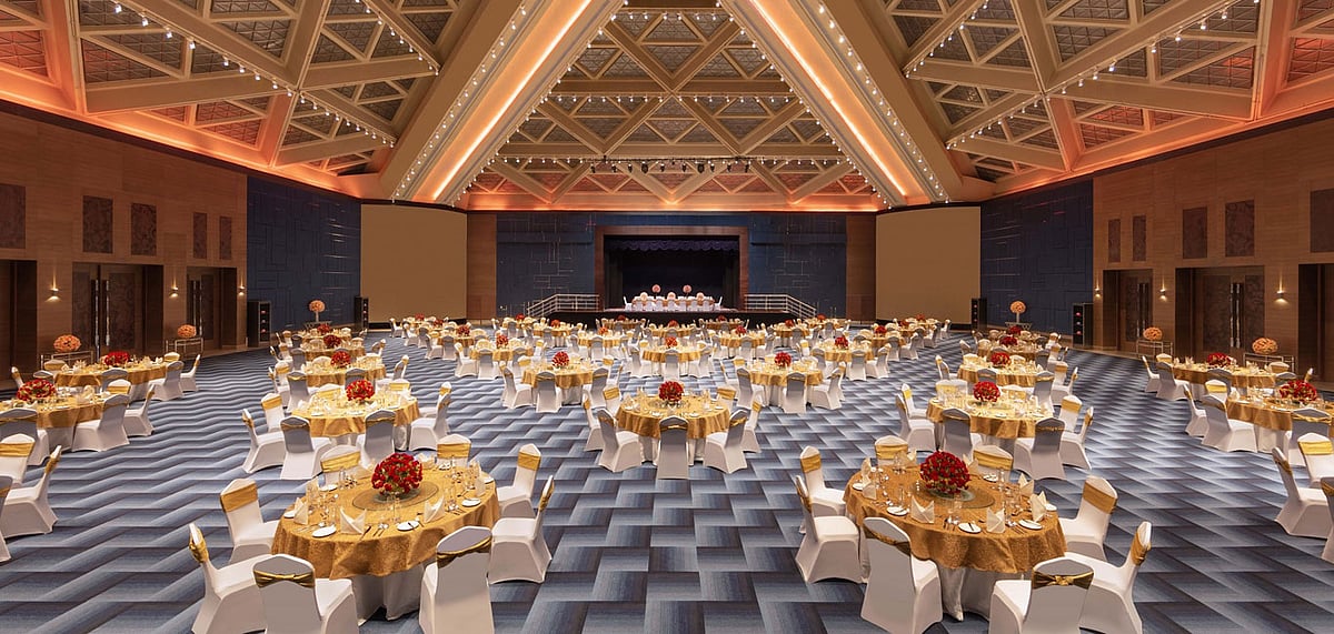 A photograph of The Sheraton Grand Bengaluru Whitefield Hotel and Convention Center - Round Table Set-up