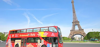 A tour bus in front of the Eiffel tower