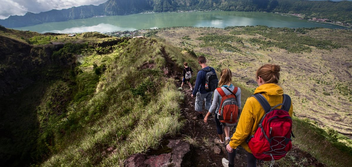 Hikers walking on caldera of Mount Batur volcano in Bali, Photo Credit Shutterstock