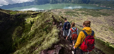 Hikers walking on caldera of Mount Batur volcano in Bali, Photo Credit Shutterstock