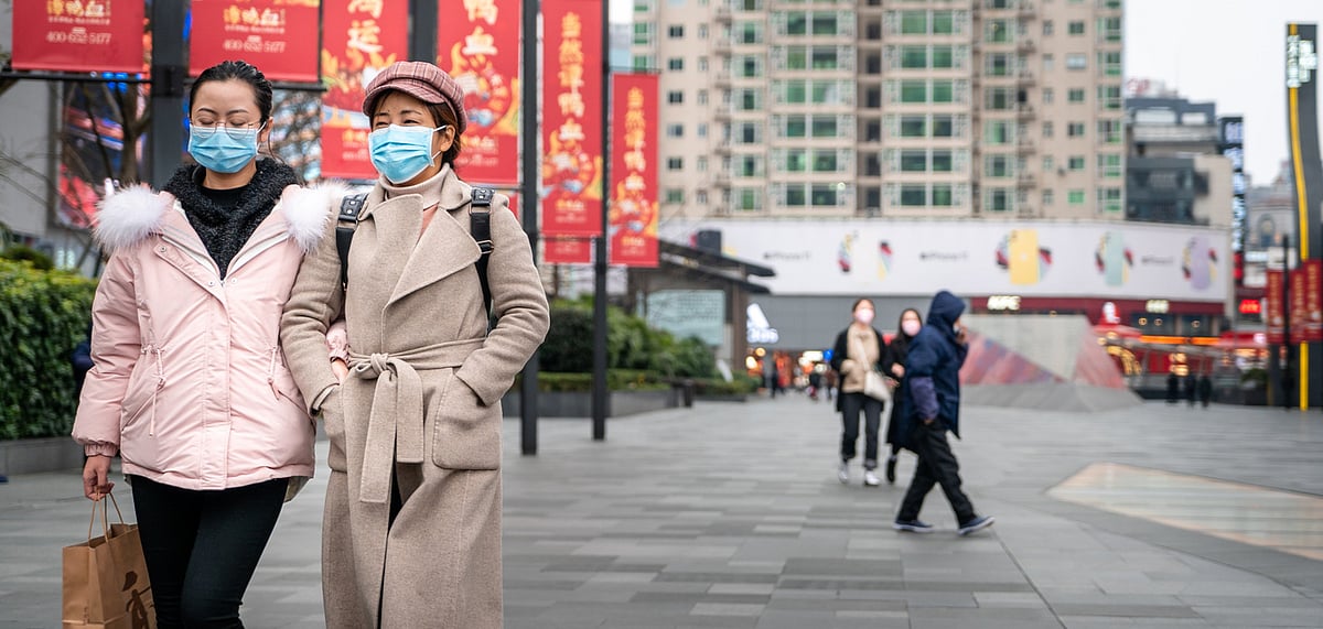 Chinese citizens wearing facemasks to contain the spread of the novel coronavirus 