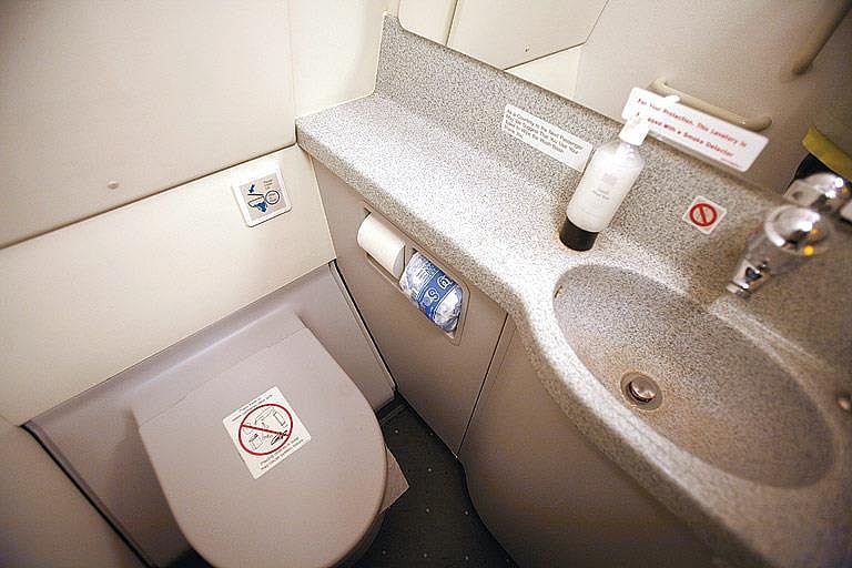 Flush after use - an aeroplane toilet