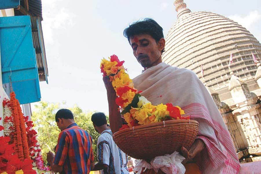 Jitendra Sarma, a barapujari at the Kamakhya temple in Guwahati, Assam, has to guide hundreds of devotees to the sanctum sanctorum on days when he has that duty. Other days are relatively light and spent performing minor pujas.