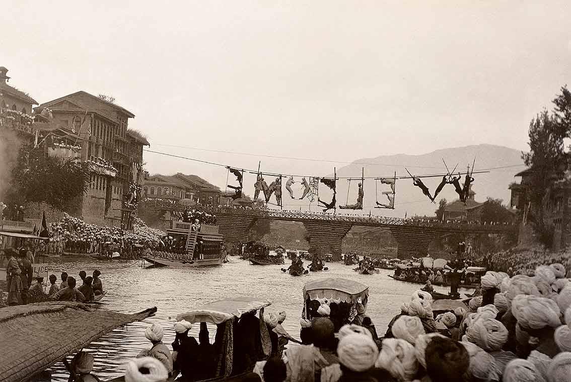 Welcome Made by Bodies on 3rd Bridge, Srinagar, circa 1910s-20s from The Marshall Albums Photography and Archaeology, edited by Sudeshna Guha, published by Mapin Publishing in association with the Alkazi Collection of Photography, 2010.