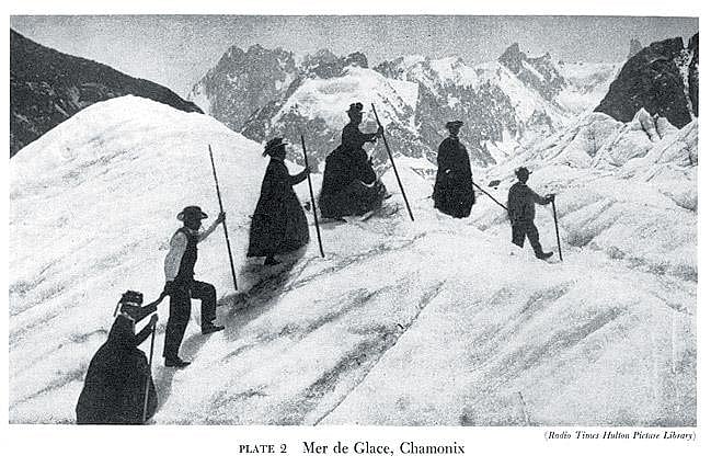 English tourists explore the Mer de Glace glacier with their French guides