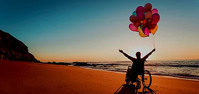 Handicapped person on wheelchair at the beach.