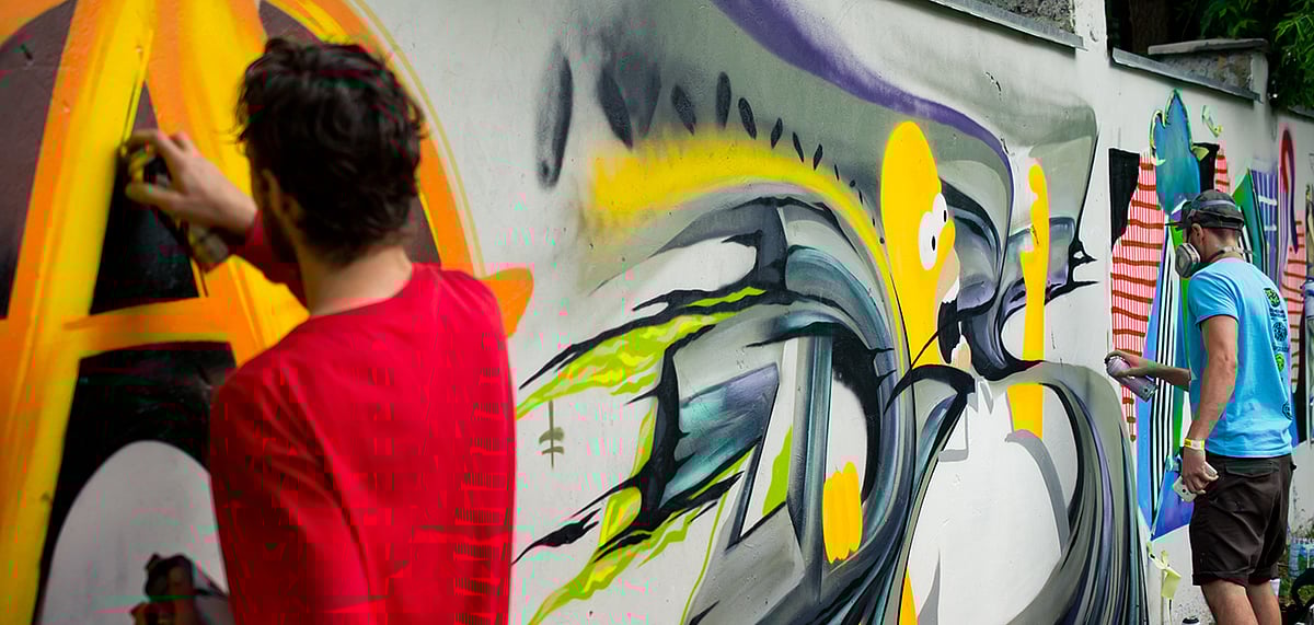 Artists working on a graffiti