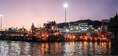 Shutterstock : Devotees line up on the banks of the Ganges during the Kumbh Mela