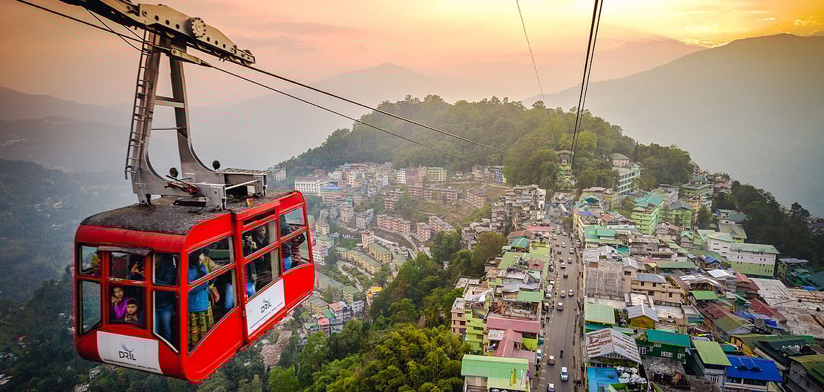 Tourists enjoy a ropeway cable car ride over Gangtok, Sikkim during sunset. (Representative Image)