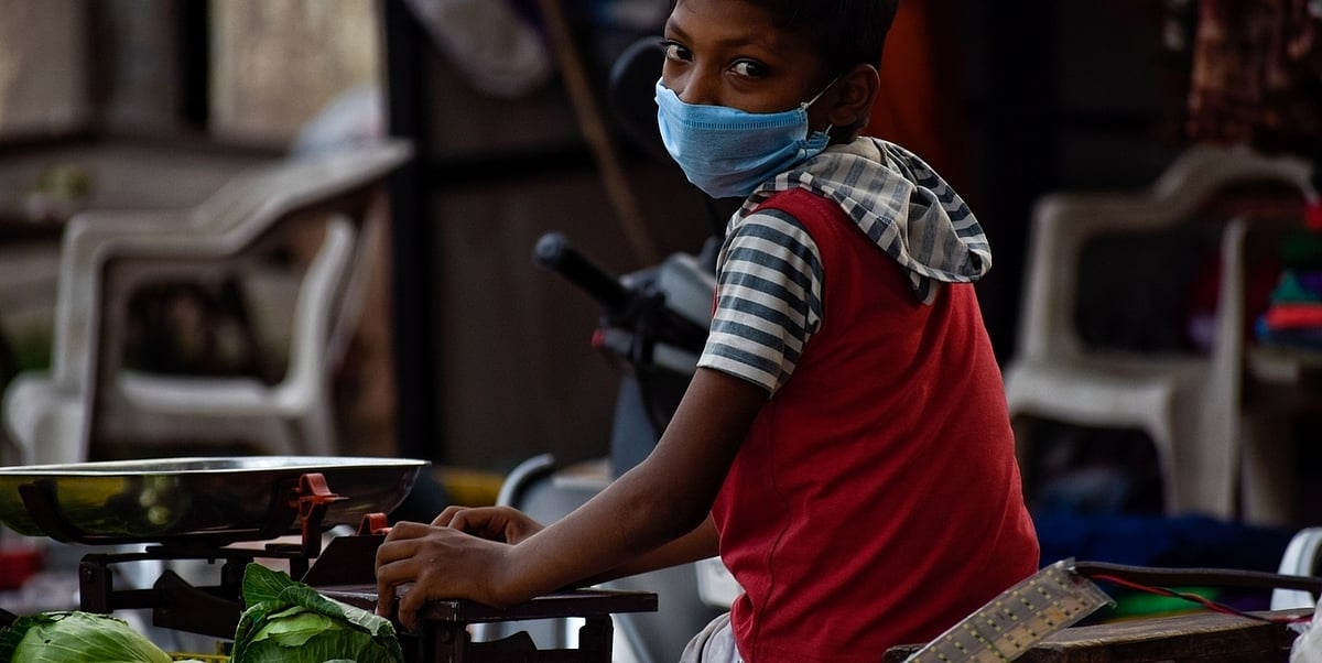 A child sells vegetables in Bharuch, Gujarat