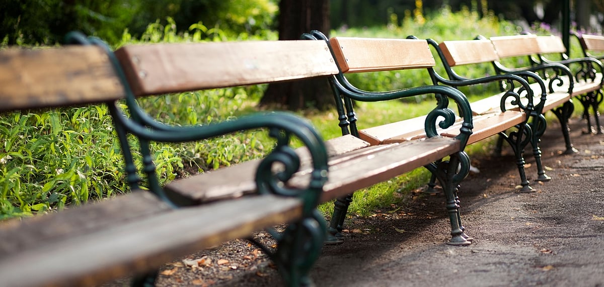 Empty park benches at the Rathauspark in Vienna, Austria