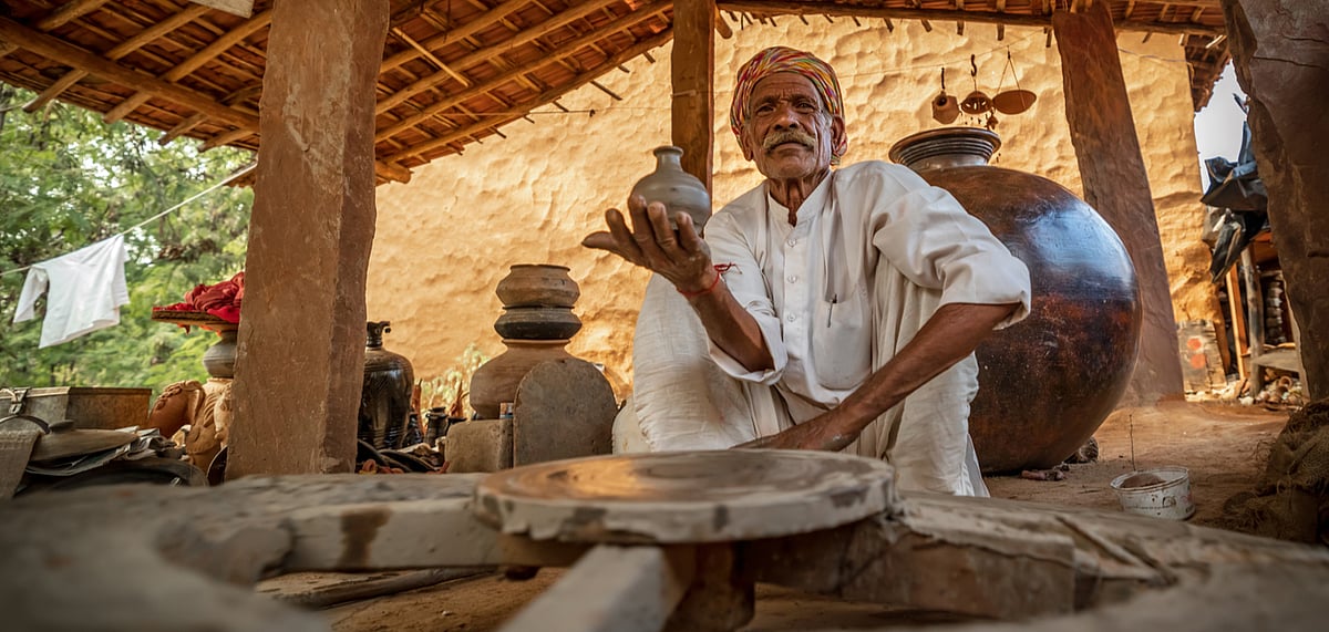A potter shows off his ceramic works 