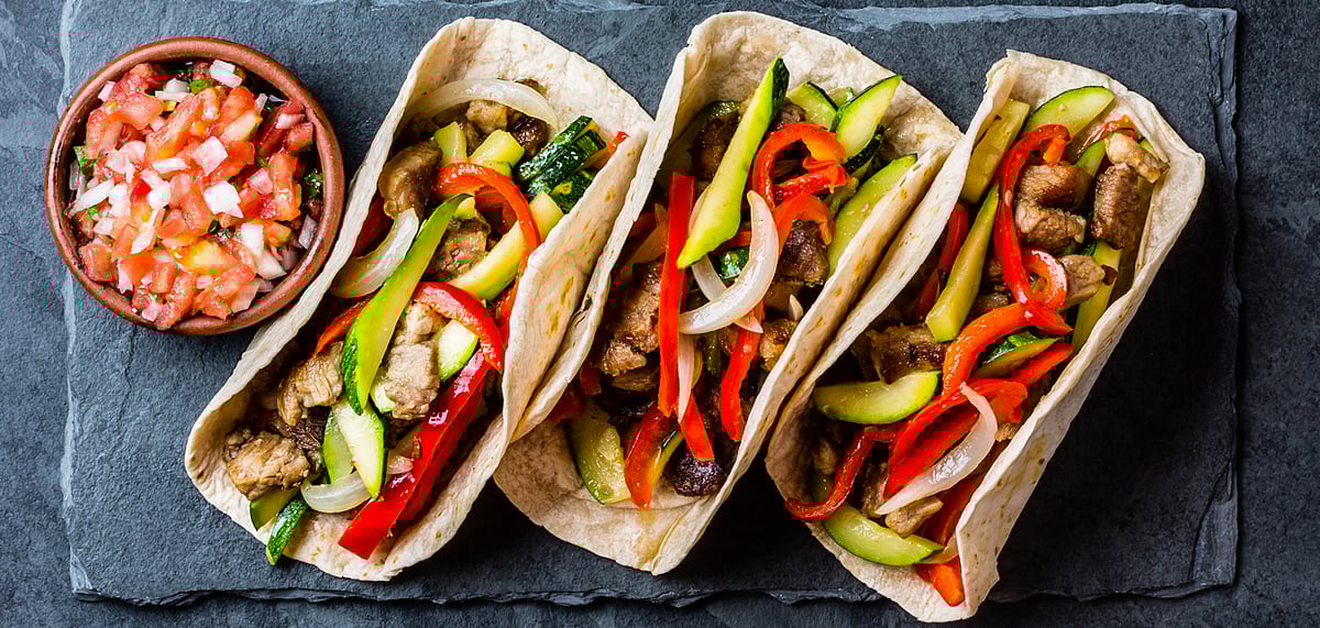 Mexican pork tacos with vegetables and salsa