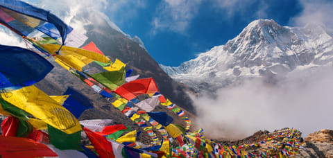 Prayer flags at the Everest basecamp with Mt Annapurna in the backdrop