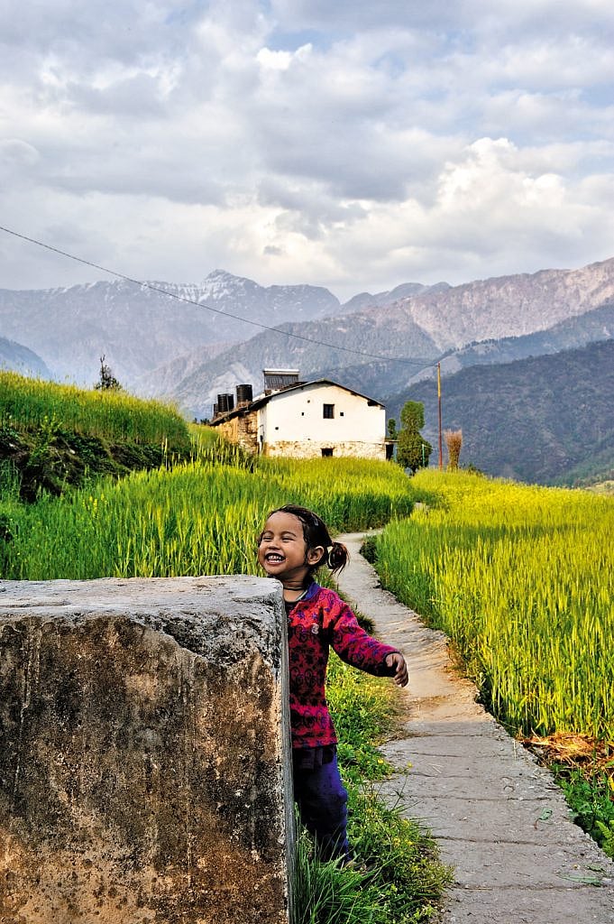 A village girl playing with tourists