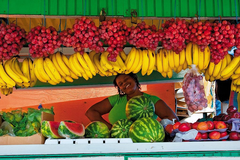 A fruit vendor poses in Scarborough
