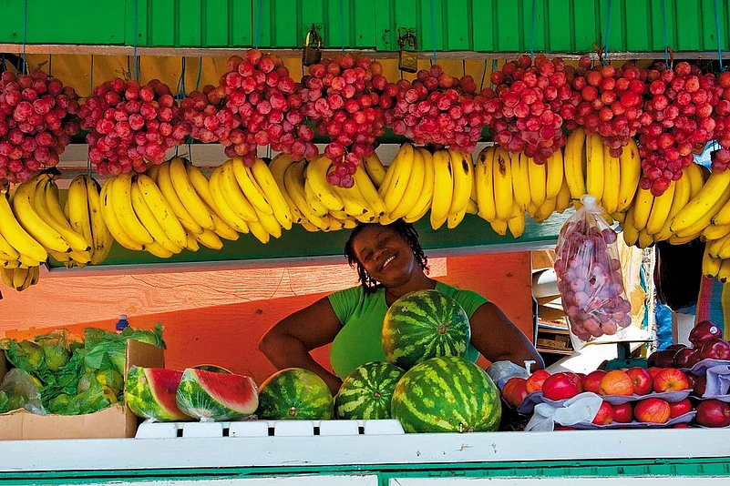 A fruit vendor poses in Scarborough