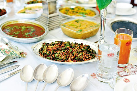 An enormous spread lies before us at the lunch table, plated in silver dishes