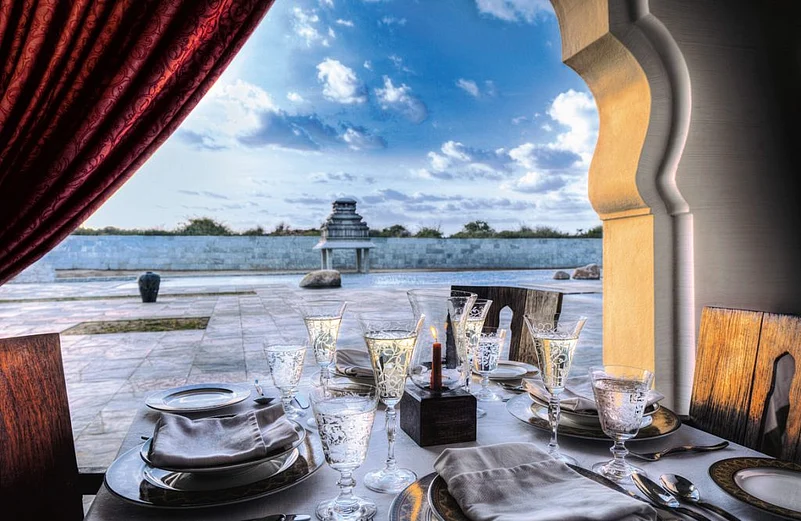 Enjoy meals at pool view restaurant Tuluva