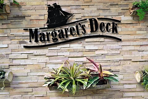 Goodricke Teapot, Margaret's Deck welcomes you with its elegant logo, plants and decoration