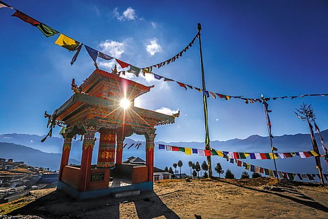 TIbetan prayer flags dress up the mountainous landscape