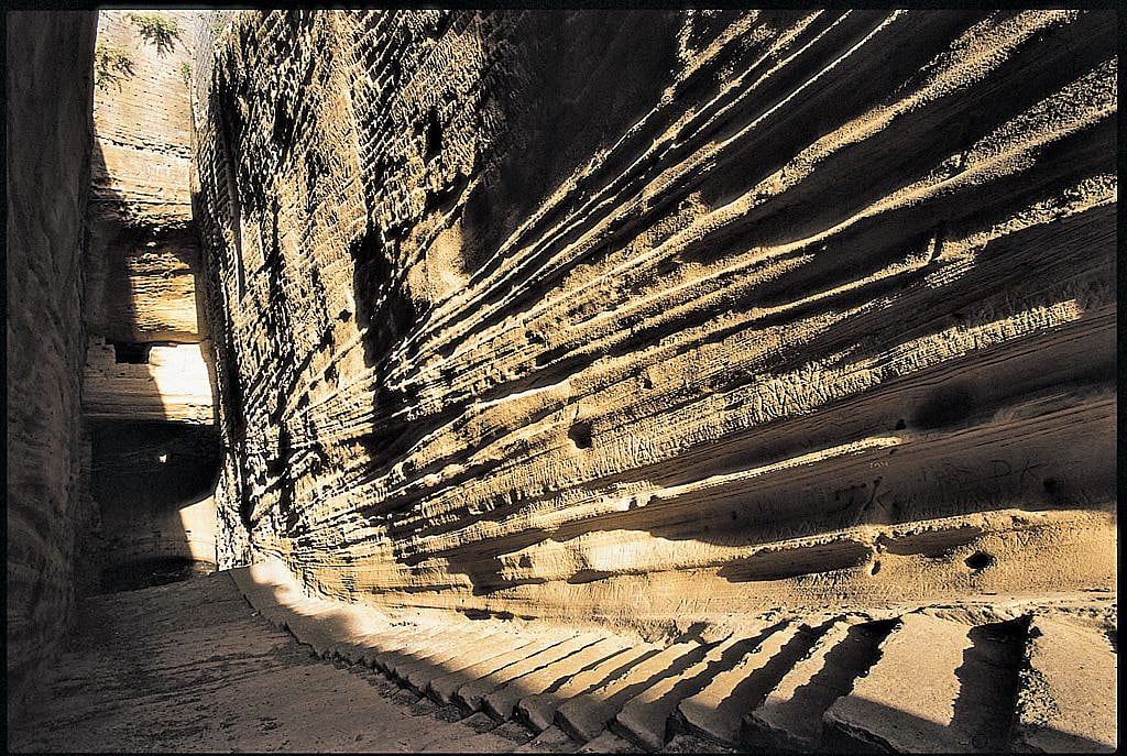 At the foot of Girnar Hill is the rock on which Ashokas 14 edicts in Brahmi script are carved