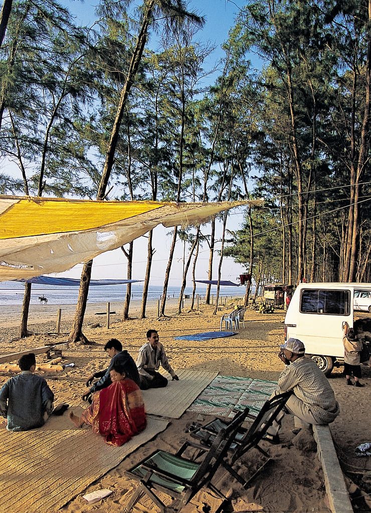 Holidayers laze on the beach