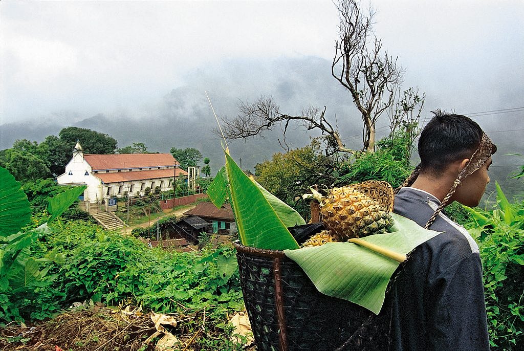 A local villager carrying fruits in bamboo basket