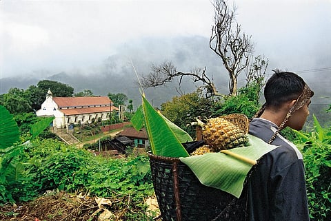 A local villager carrying fruits in bamboo basket