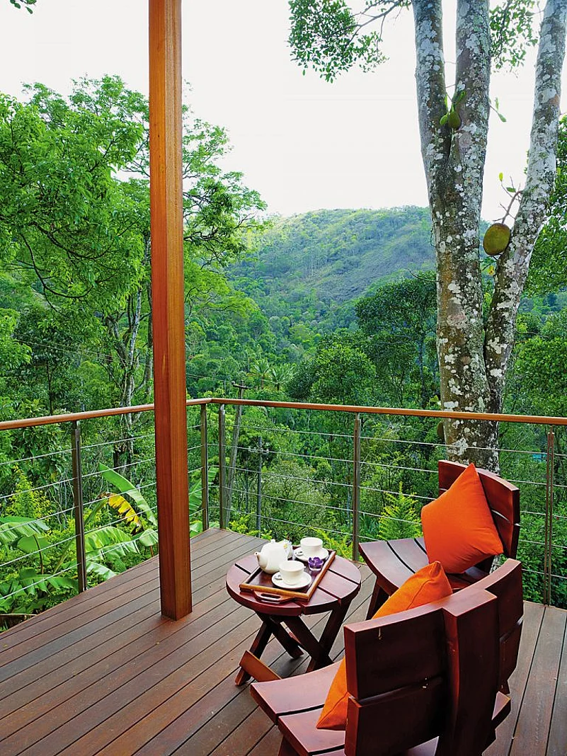 Quaint design of the Niraamaya Retreat nearly camouflaged it into the hills around