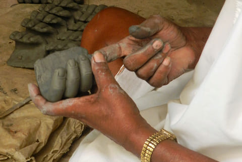 Hands at work in Kumortuli