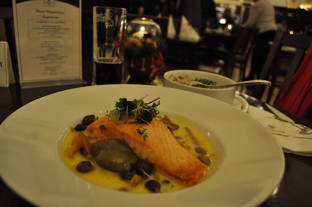 Braised Salmon Fillet with vegetables and red wine onions in Leipzig