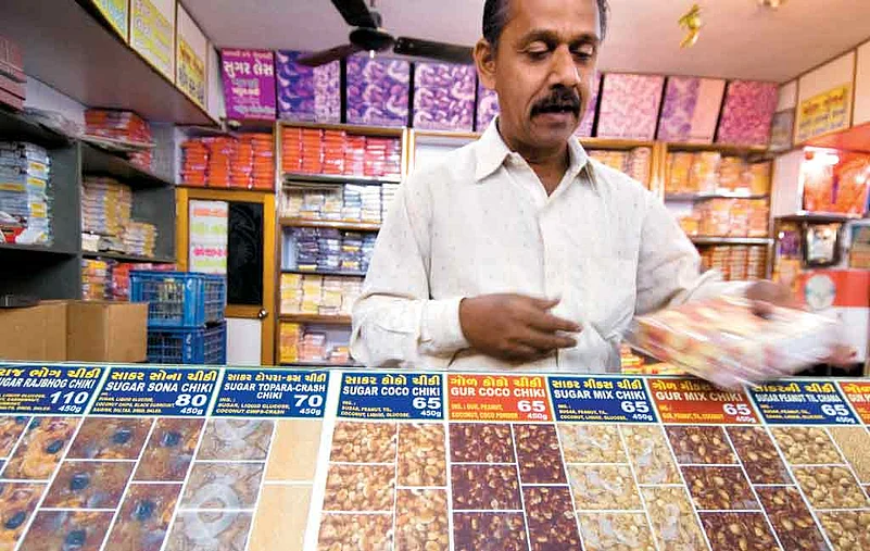 A salesman at a sweet shop in Gujrat