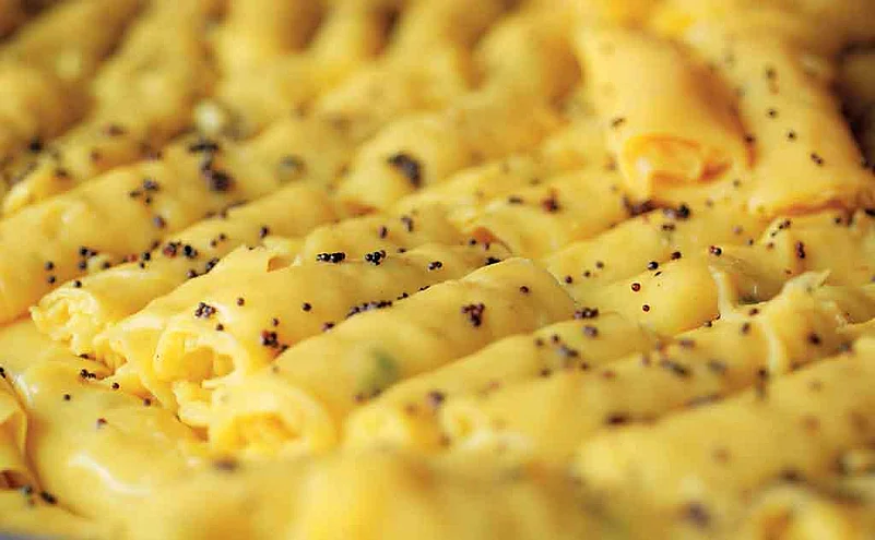 Khandvi, made of gram flour is a popular snack