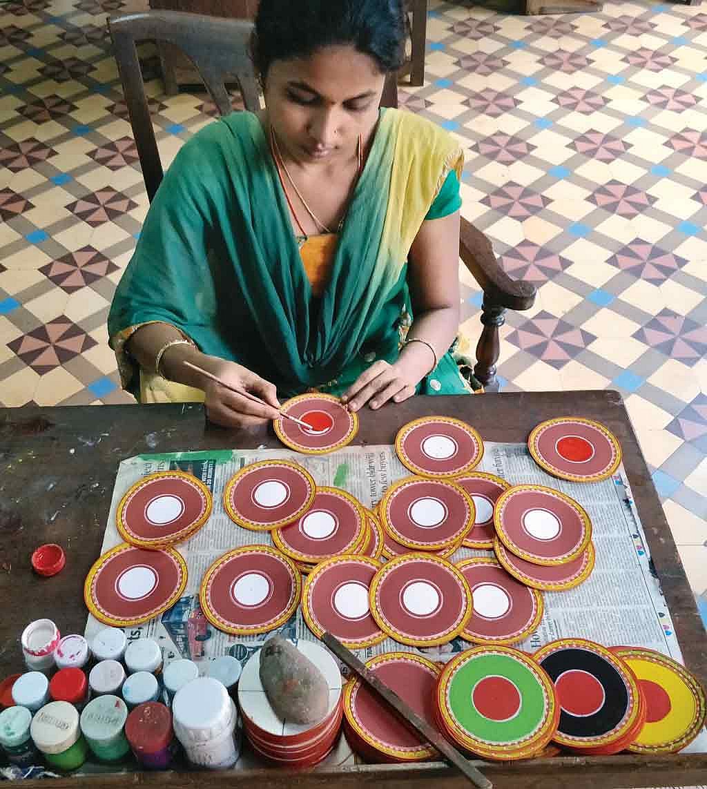 An artist painting Ganjifa cards