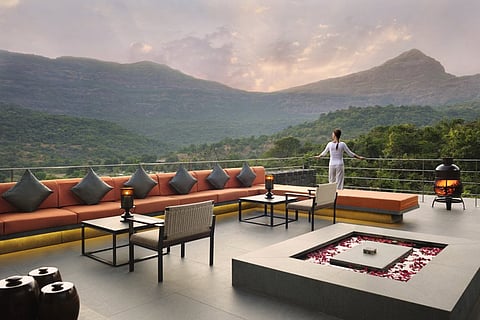 A rooftop restaurant overlooking the lush valleys