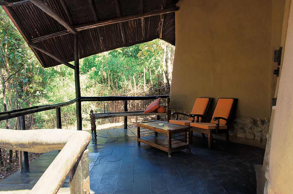 Outdoor seating at one of the cottages at Reni Pani