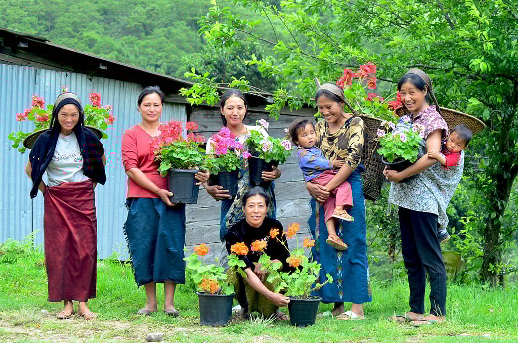 Cheerful village folks pose for a photo