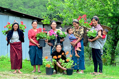 Cheerful village folks pose for a photo