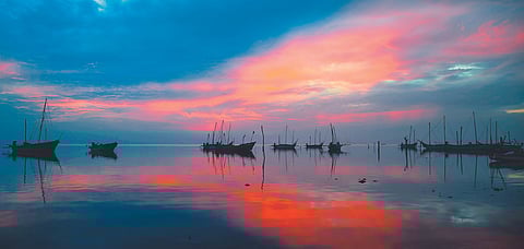 The sun sets on the coast of Devipattinam