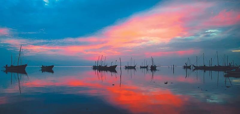 The sun sets on the coast of Devipattinam