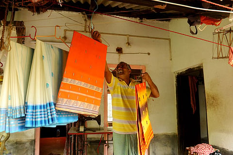A weaver in Dhaniakhali village