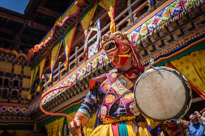 A Buddhist monk performing a traditional dance in Bhutan