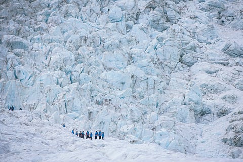 An experienced guide will equip you with all the necessary gear for your ice-climbing expedition